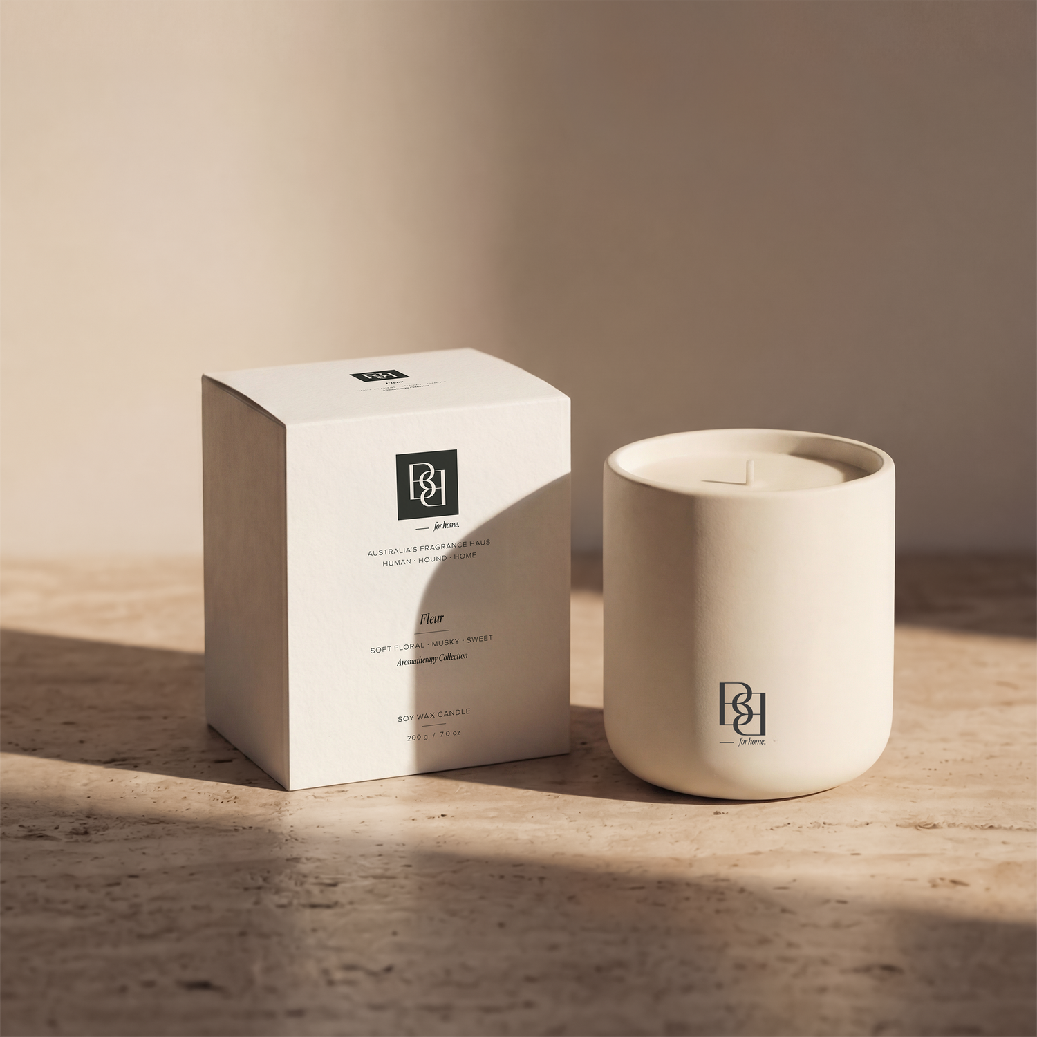 Bug & Bun Fleur dog safe reed diffuser styled on stone surface with ceramic vessel and packaging