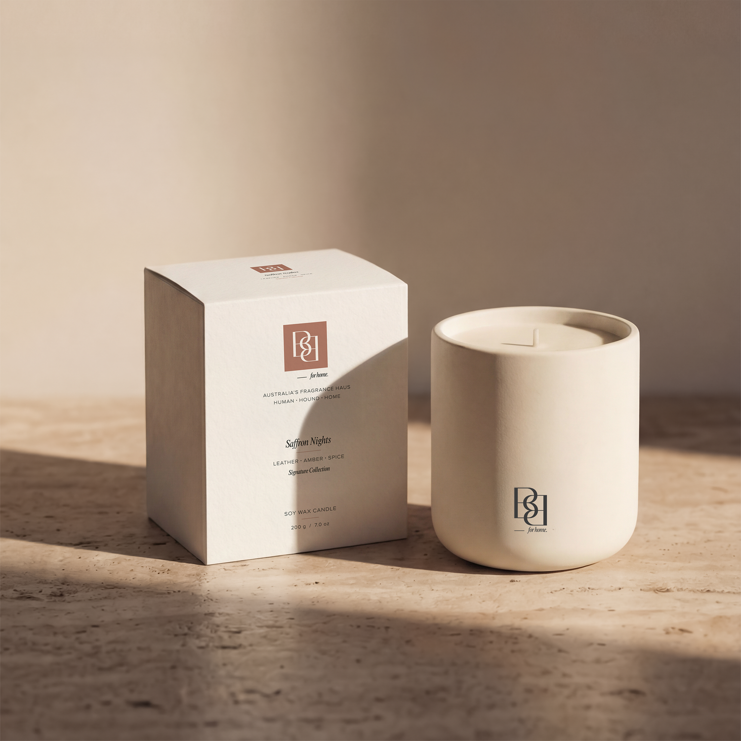 Bug & Bun Saffron Nights dog safe reed diffuser styled on stone surface with ceramic vessel and packaging