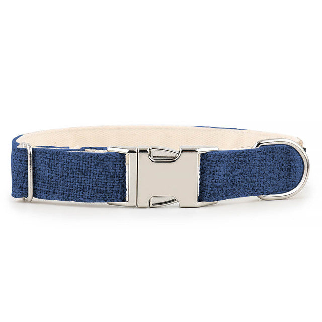 Close up photo showing the metal clip of Organic Hemp & Cotton Dog Collar Ink Blue on a white background