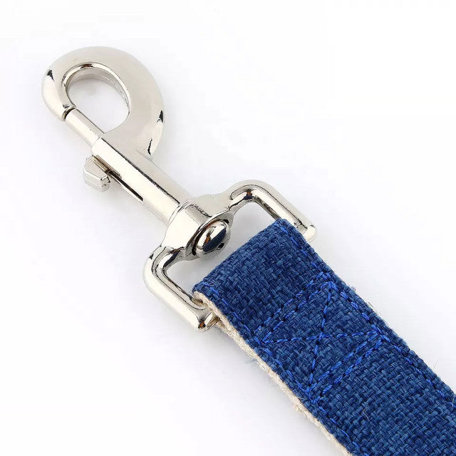 Close up of dog lead in ink blue. It details the webbing of the cotton and hemp blend as well as showing the quality metal clip attachment that goes on the collar. The image is on a white background