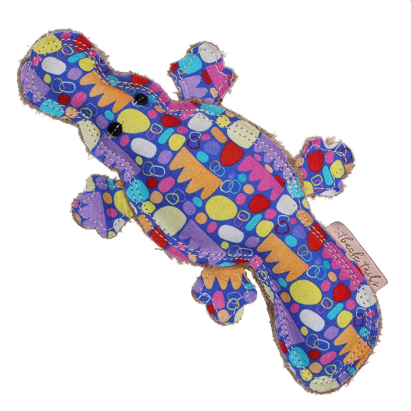 Percy the platypus dog toy by outback tails on a white background. The toys shows the indigenous artwork print and natural fibres and double stitching