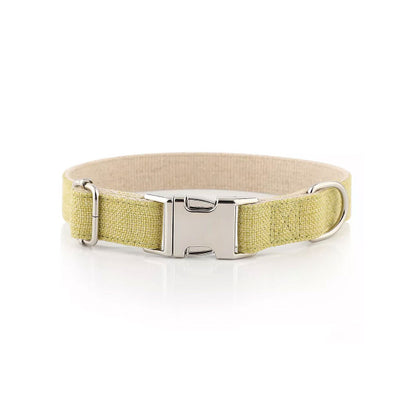 Close up photo showing the metal clip of Organic Hemp & Cotton Dog Collar Grass Green on a white background