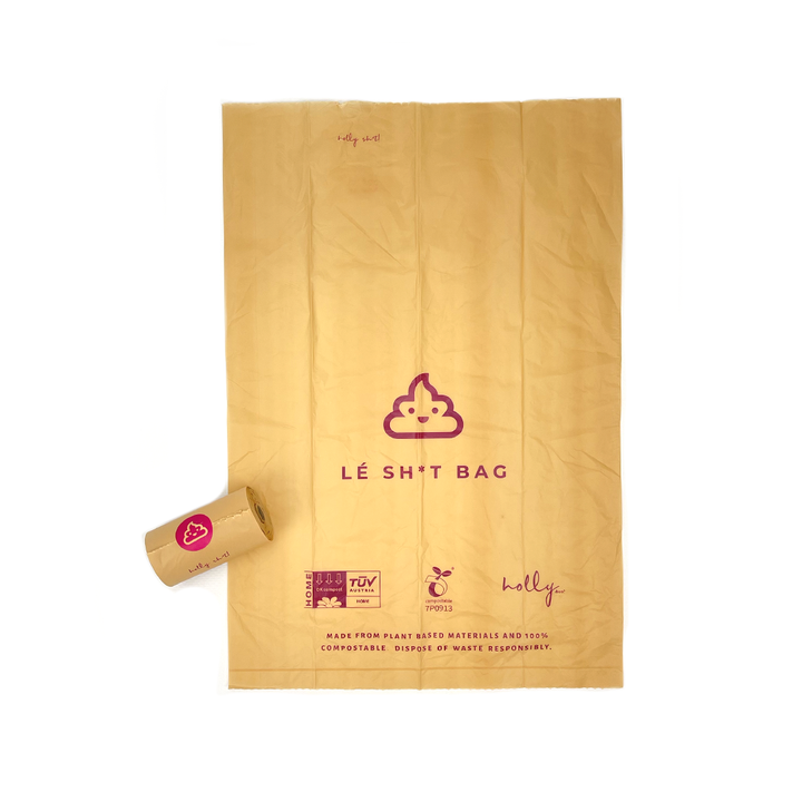 Compostable poo bag lay flat on white background